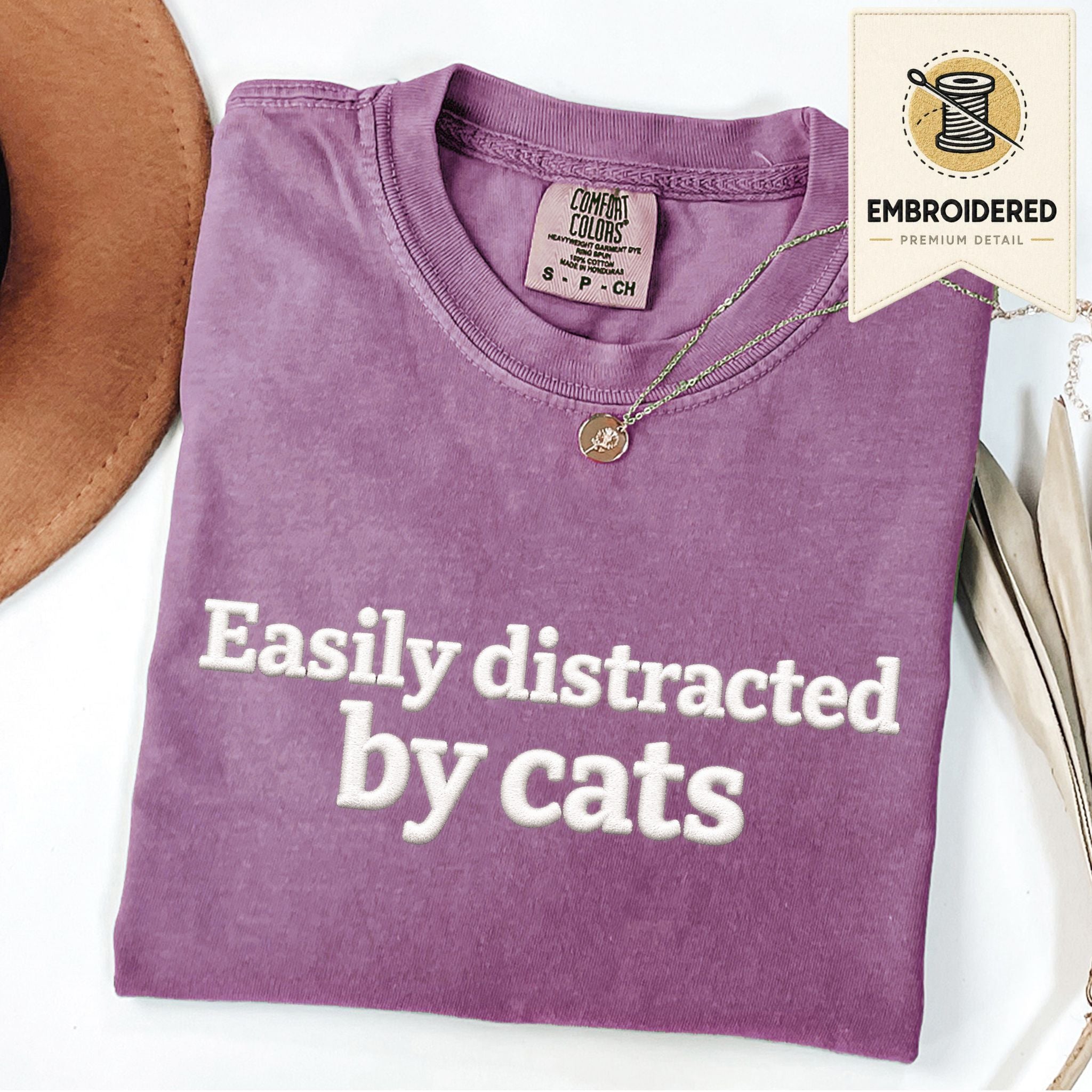 Berry embroidered cat t-shirt with 'Easily Distracted' chest design, shown flat