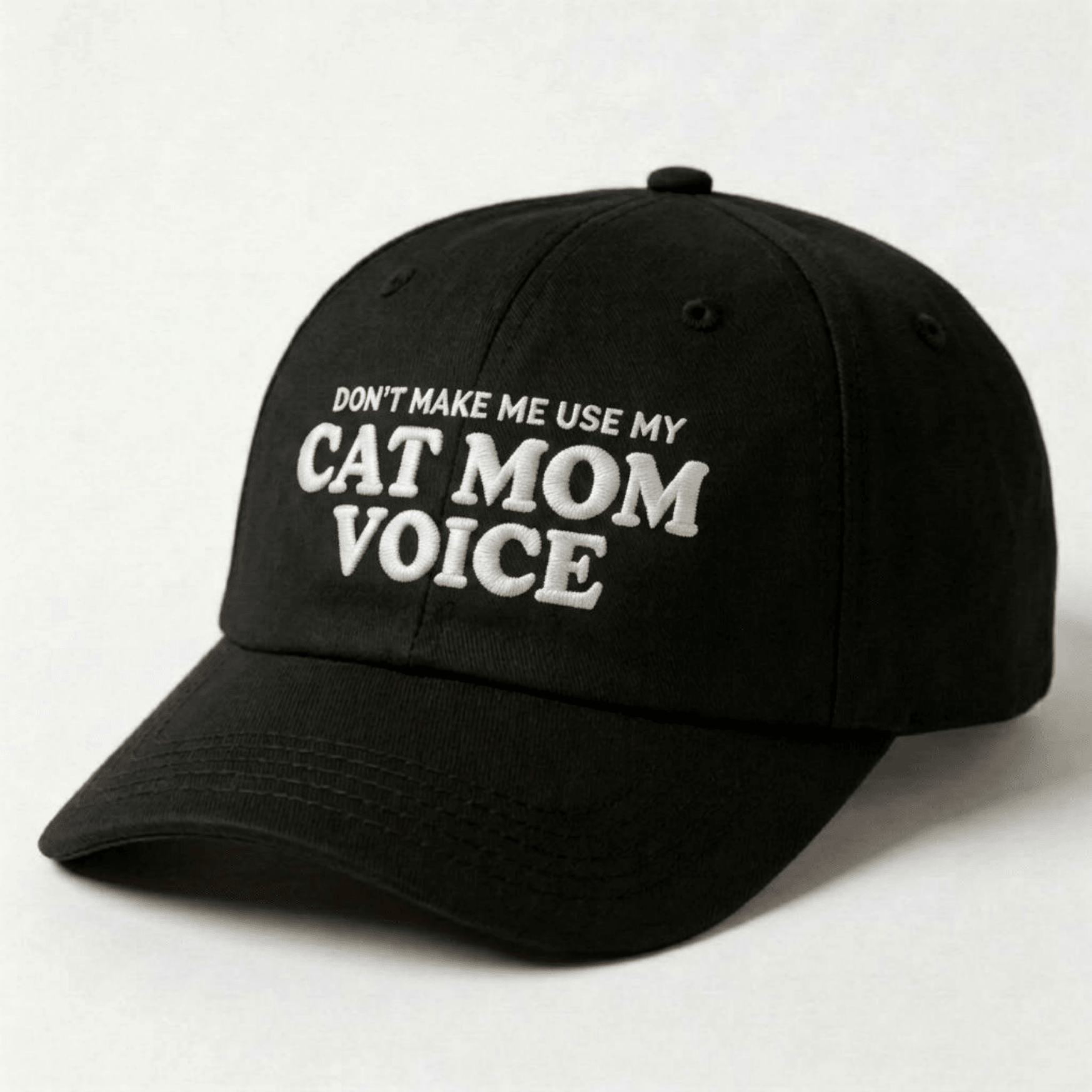 Black embroidered cat mom hat with white text reading “Don’t Make Me Use My Cat Mom Voice”