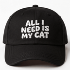 Black embroidered cap with white text that says “All I Need Is My Cat” shown from the front