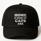 Black cap with white text that says “Home Is Where My Cats Are” shown from the front