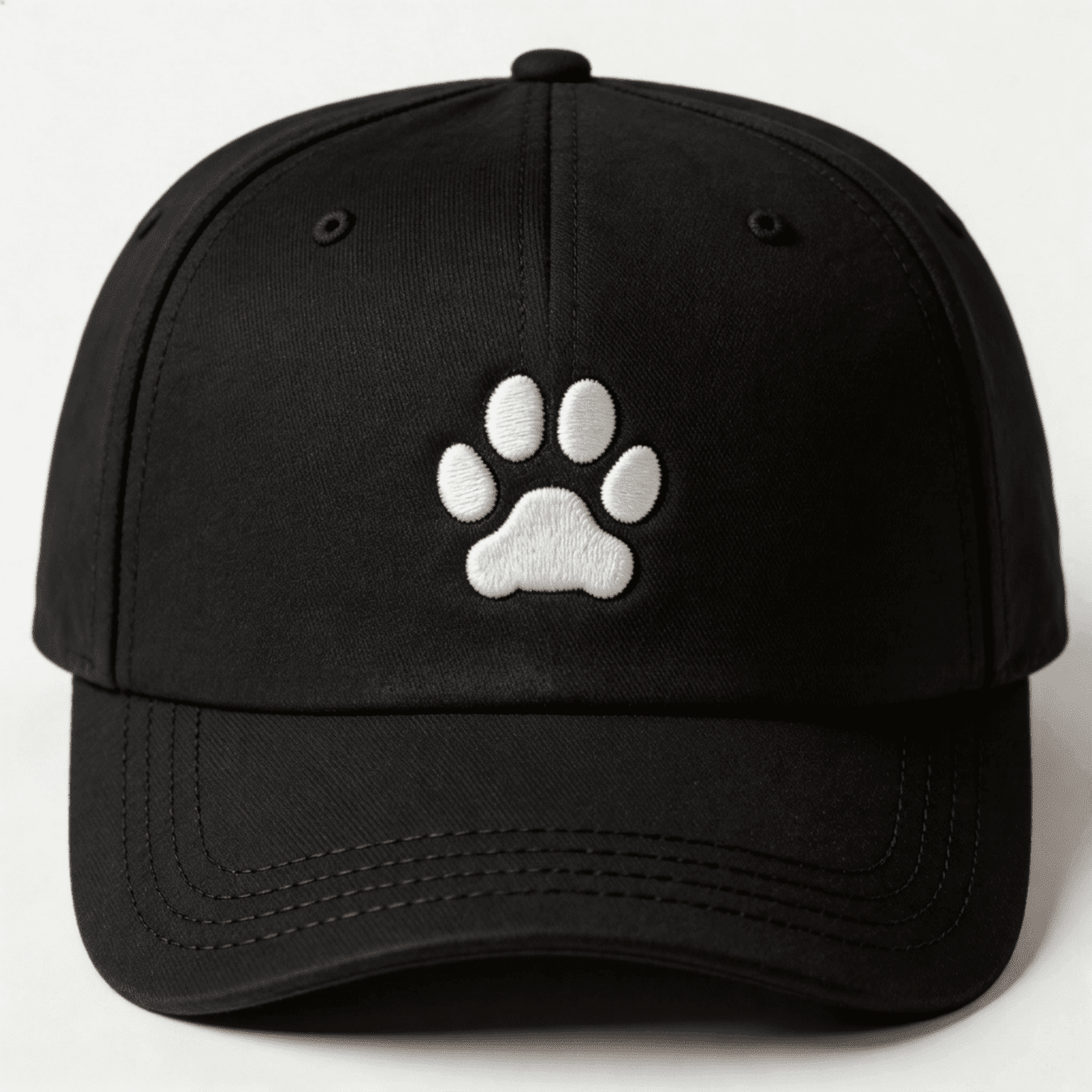 Black embroidered cap with white paw print design shown from the front
