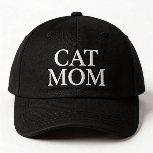 Black embroidered cap with white text that says “Cat Mom” shown from the front
