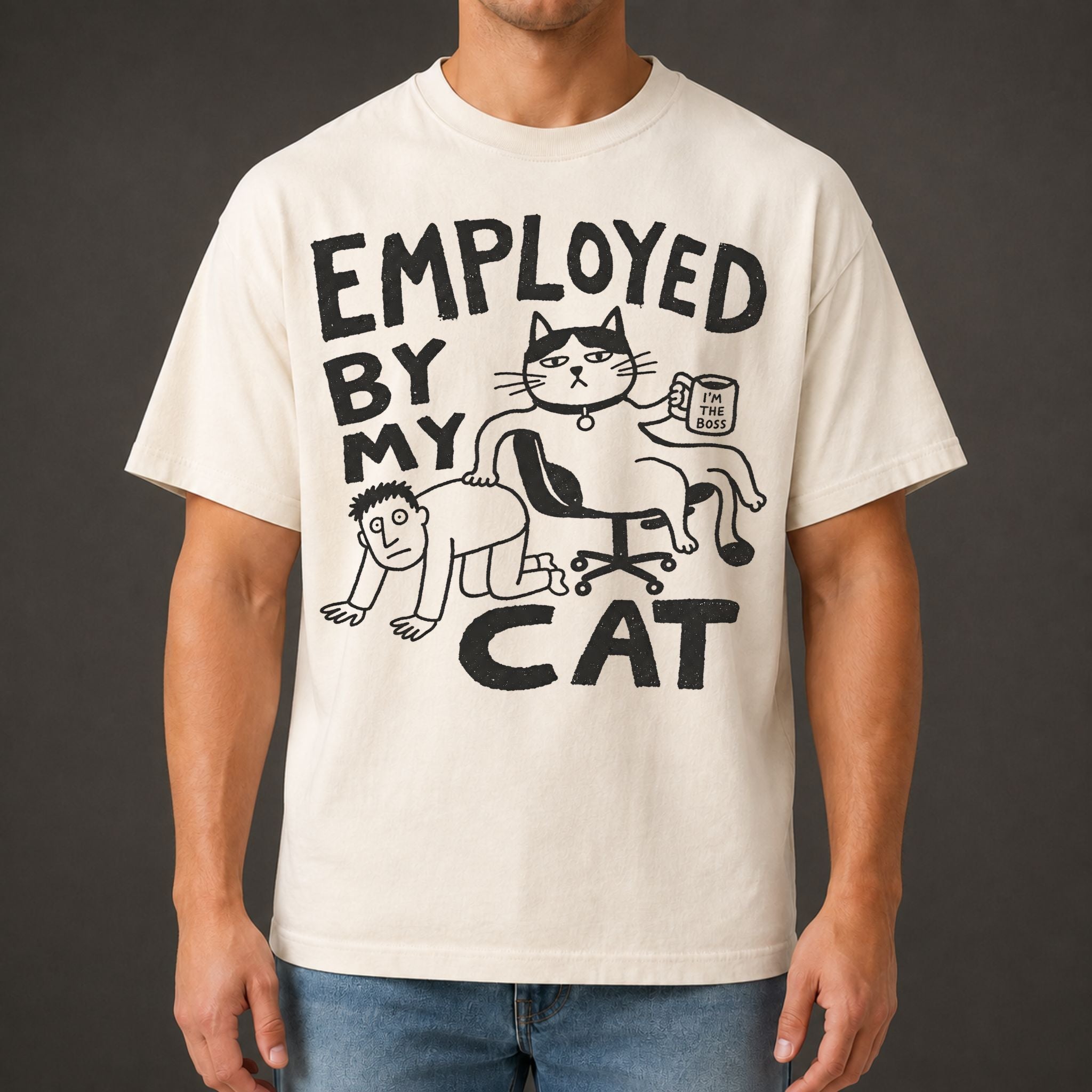 Employed By My Cat T-Shirt in ivory with illustrated cat graphic on male model
