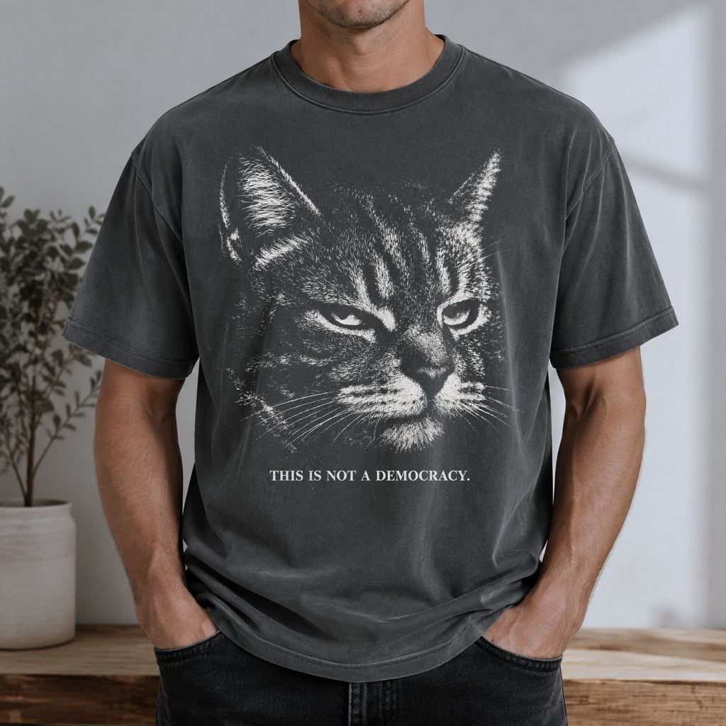 Man wearing a Pepper cat t-shirt with stern tabby cat and This Is Not A Democracy text