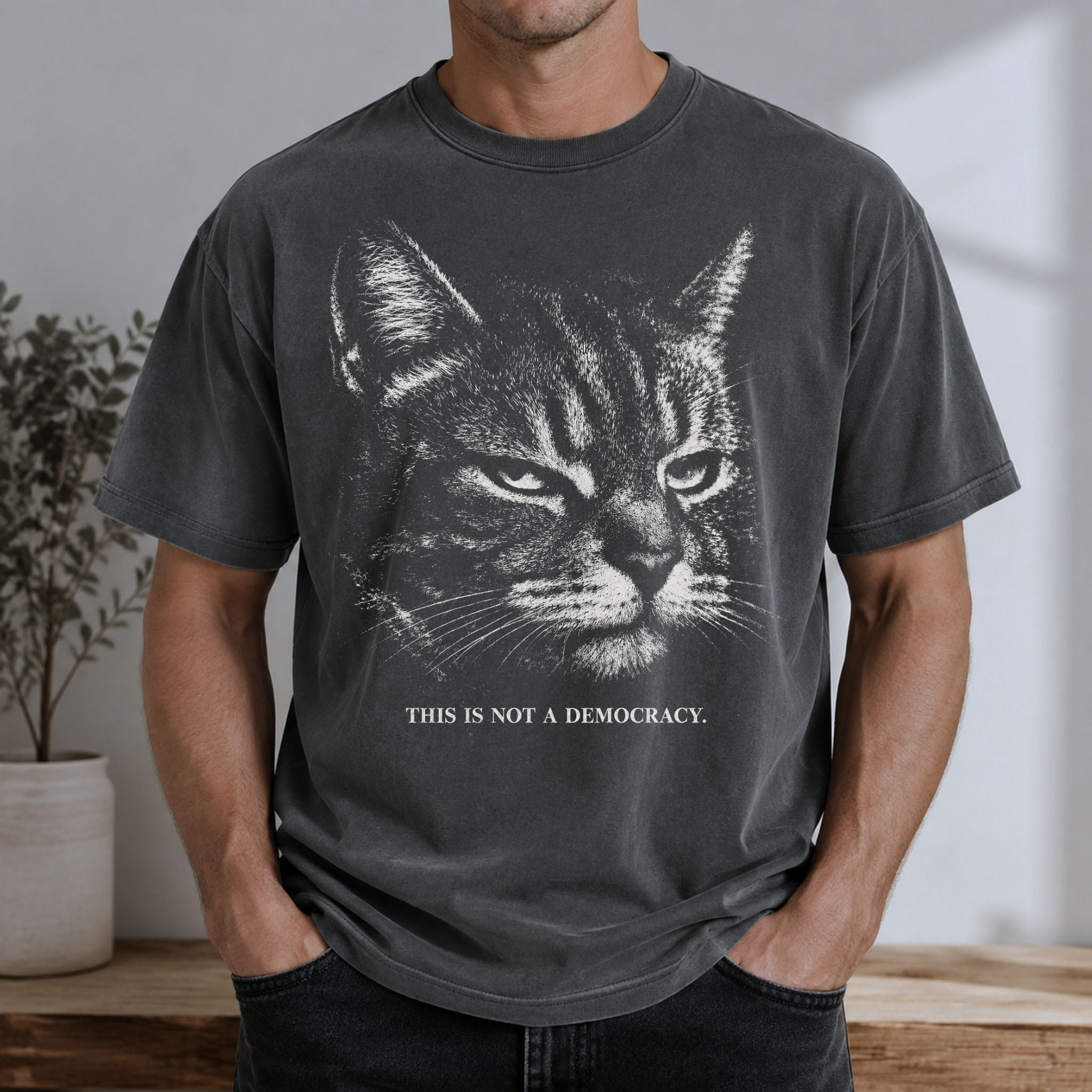 Man wearing a Pepper cat t-shirt with stern tabby cat and This Is Not A Democracy text