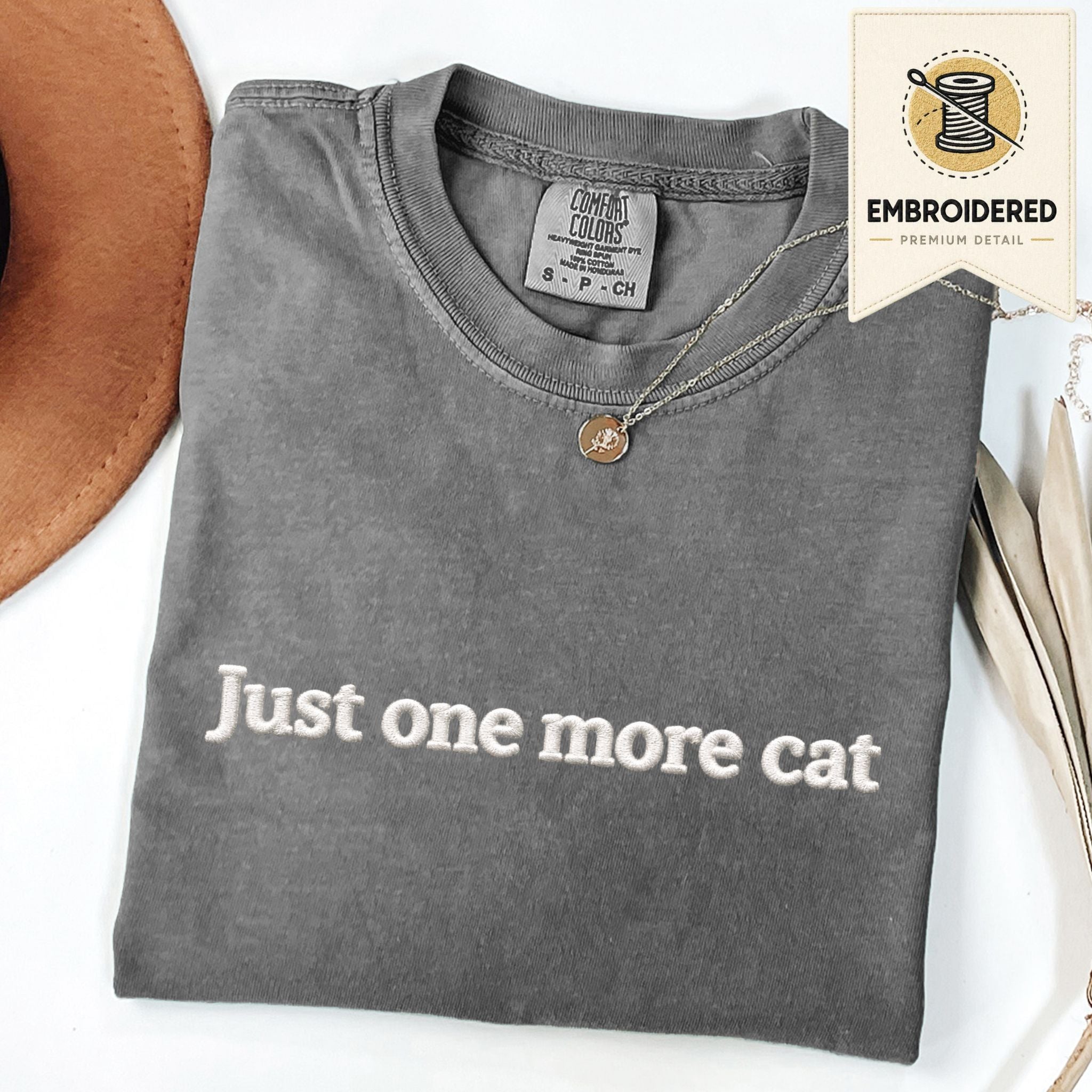 Pepper embroidered cat t-shirt with 'Just One More Cat' chest design, shown flat